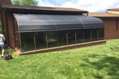 Exterior roll drop shades, 3 shades each covering 3 bays.